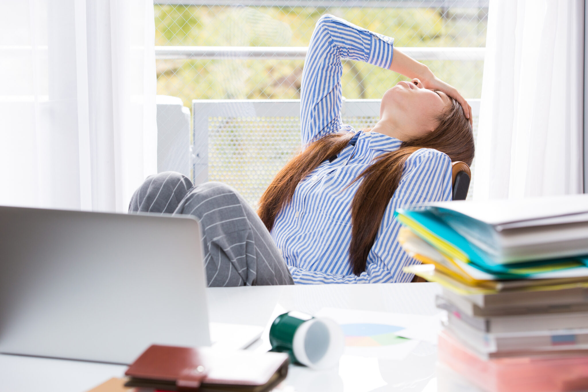 business woman holding her head