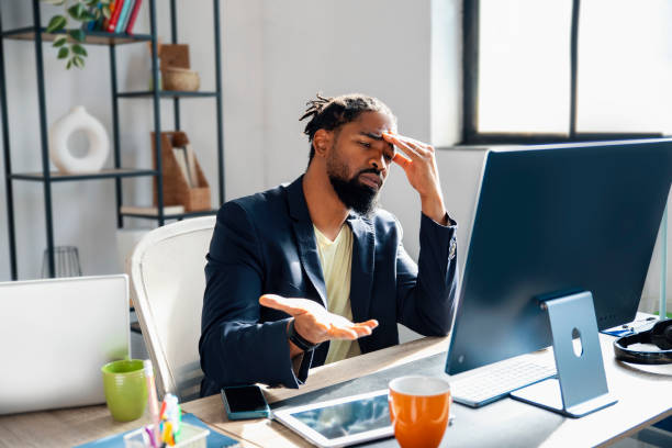 Young Businessman in tough discussion on internet meeting at his office