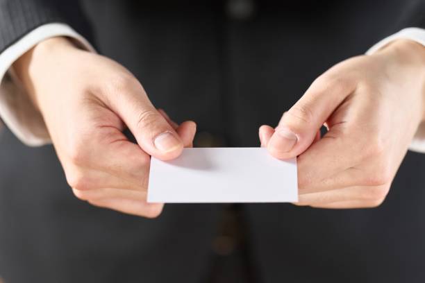 <img src="puppy.jpg" alt="Hand of a businessman holding out a business card"/>