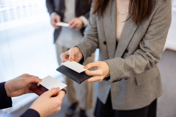 Business people changing business card