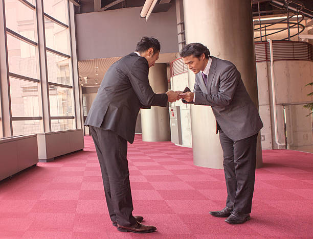 Japanese business partners exchanging businesscard at kyoto japan