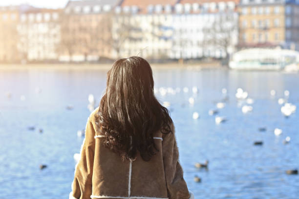 Happy japanese woman tourist sightseeing in popular tourist area, Copenhagen, Denmark. - February 15, 2017